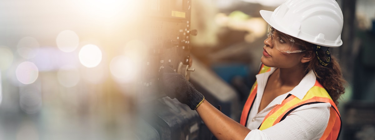 Woman manipulating a machine